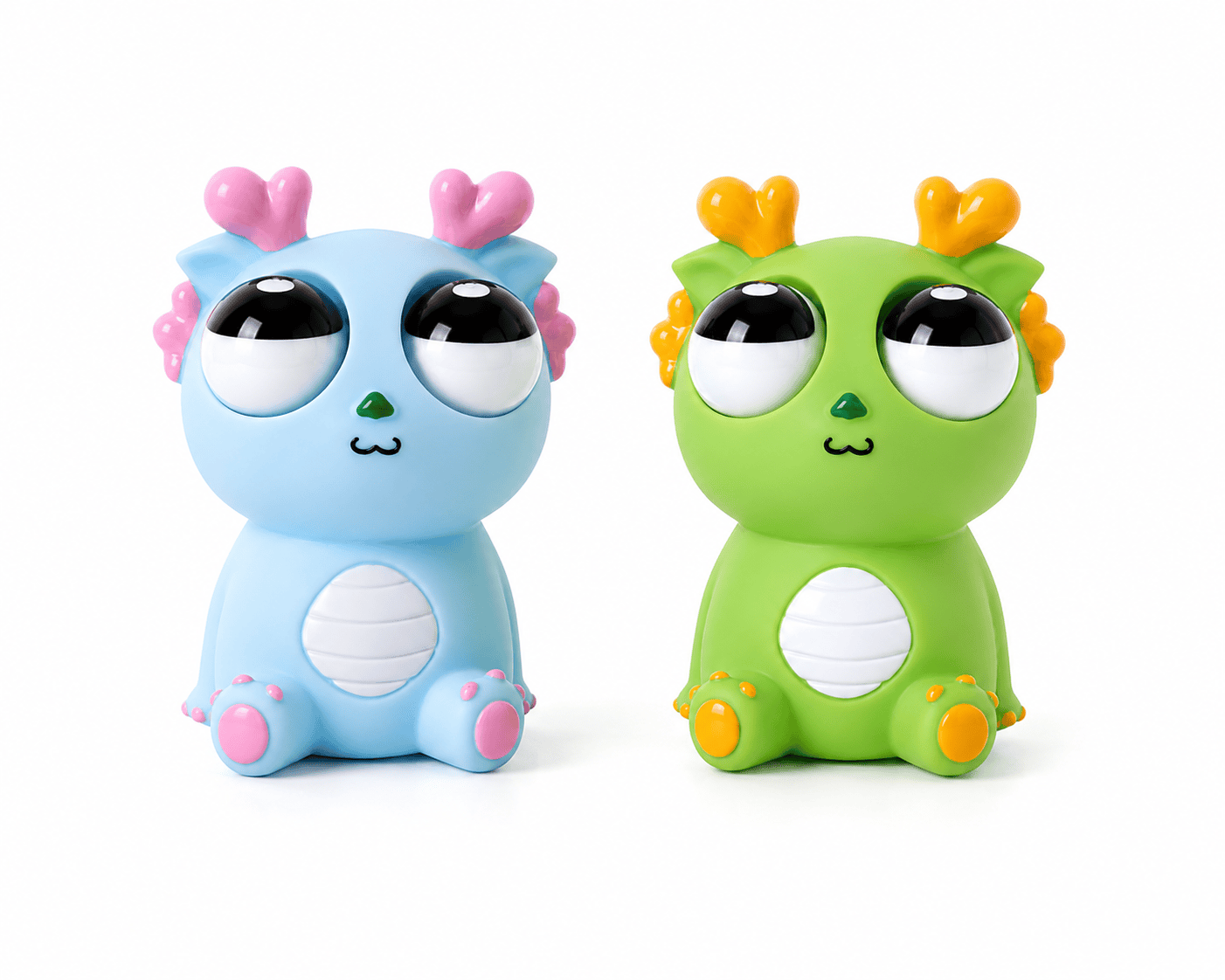 Blue and green heart-horn monster vinyl figurines with big glossy eyes, sitting side by side